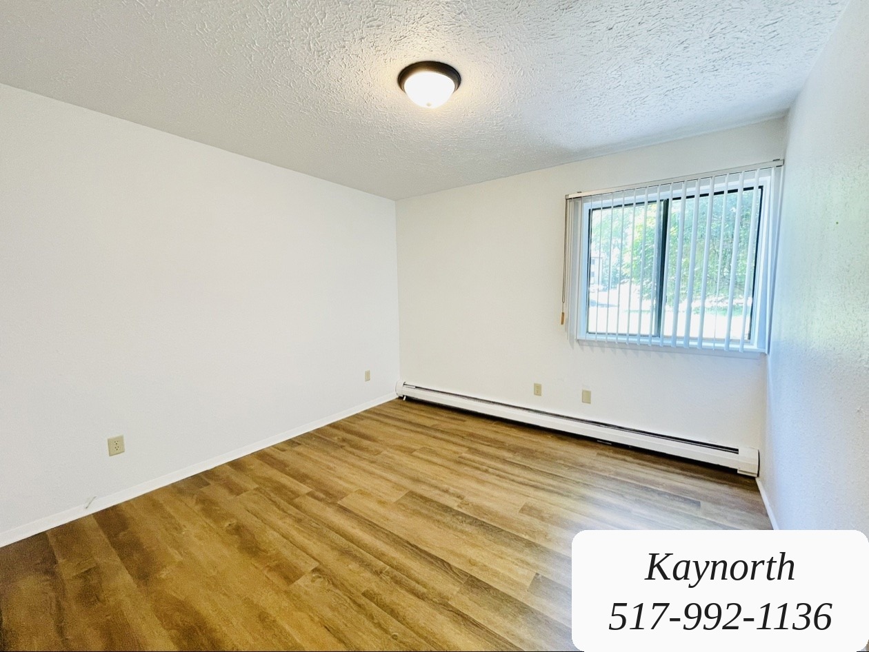 Bright bedroom with window blinds in a Kaynorth apartment